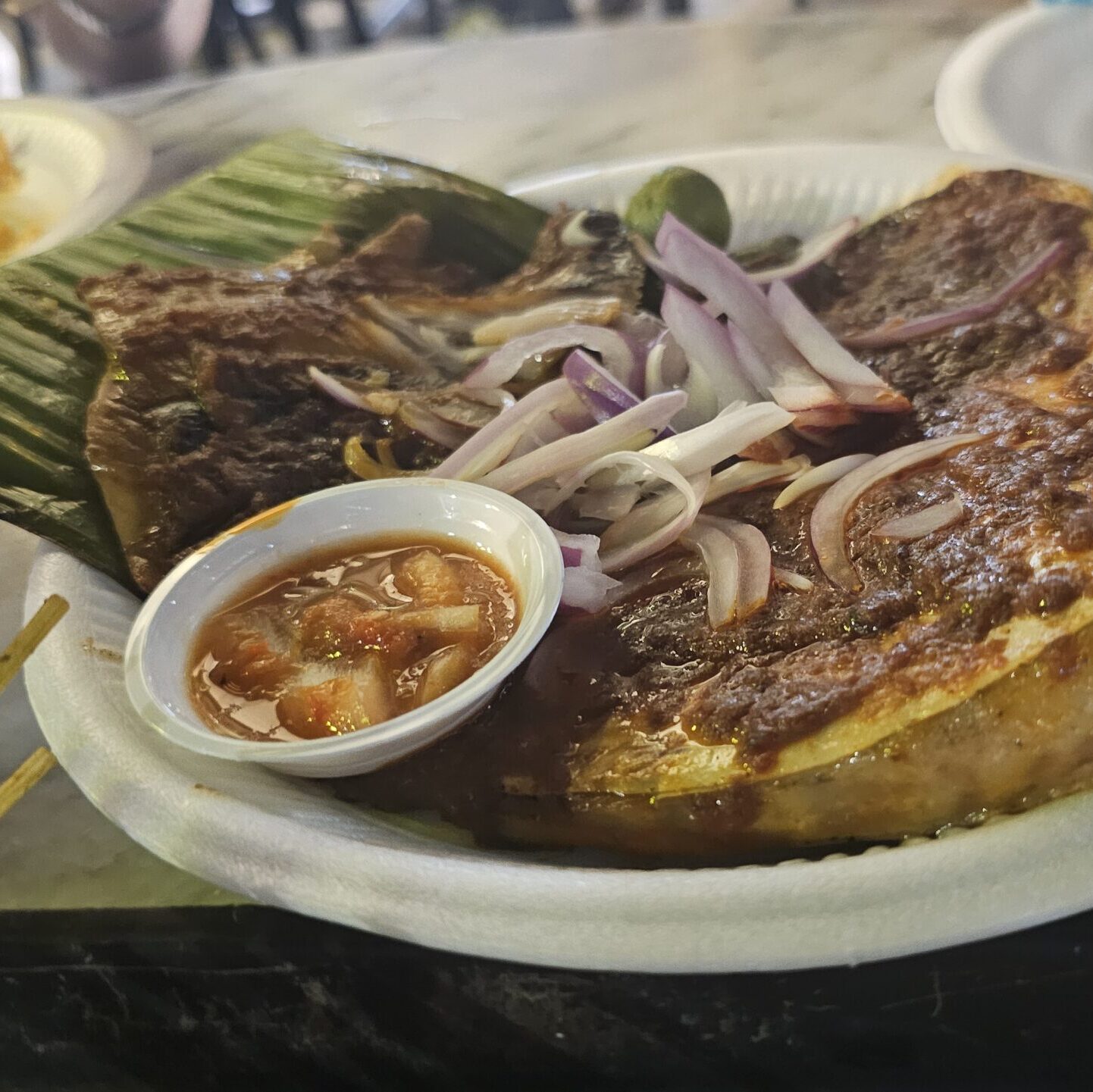 Sambal stingray dish with spicy sauce at Lau Pa Sat, Singapore