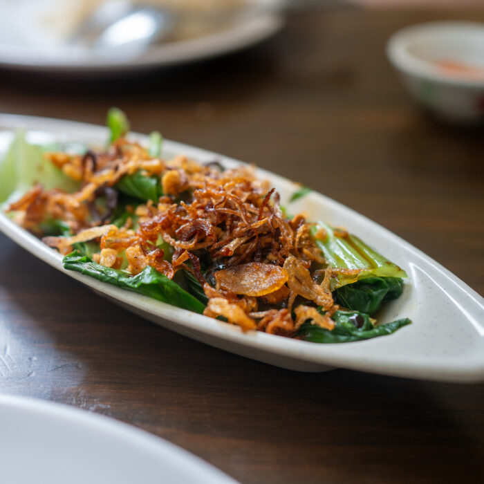 Stir-fried bok choy dish, also known as Xiao Bai Cai, served at Nat's Chicks.