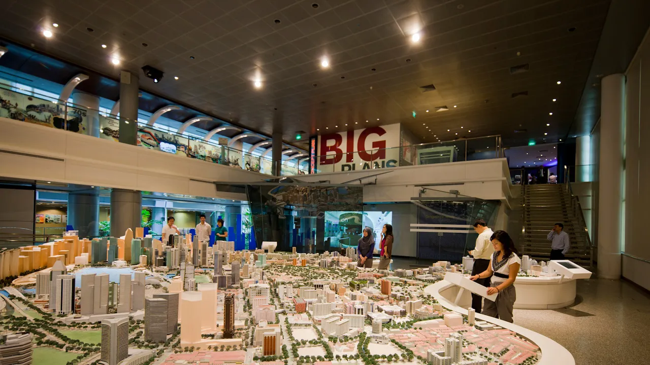 Visitors engaging with an interactive digital display at Singapore City Gallery.