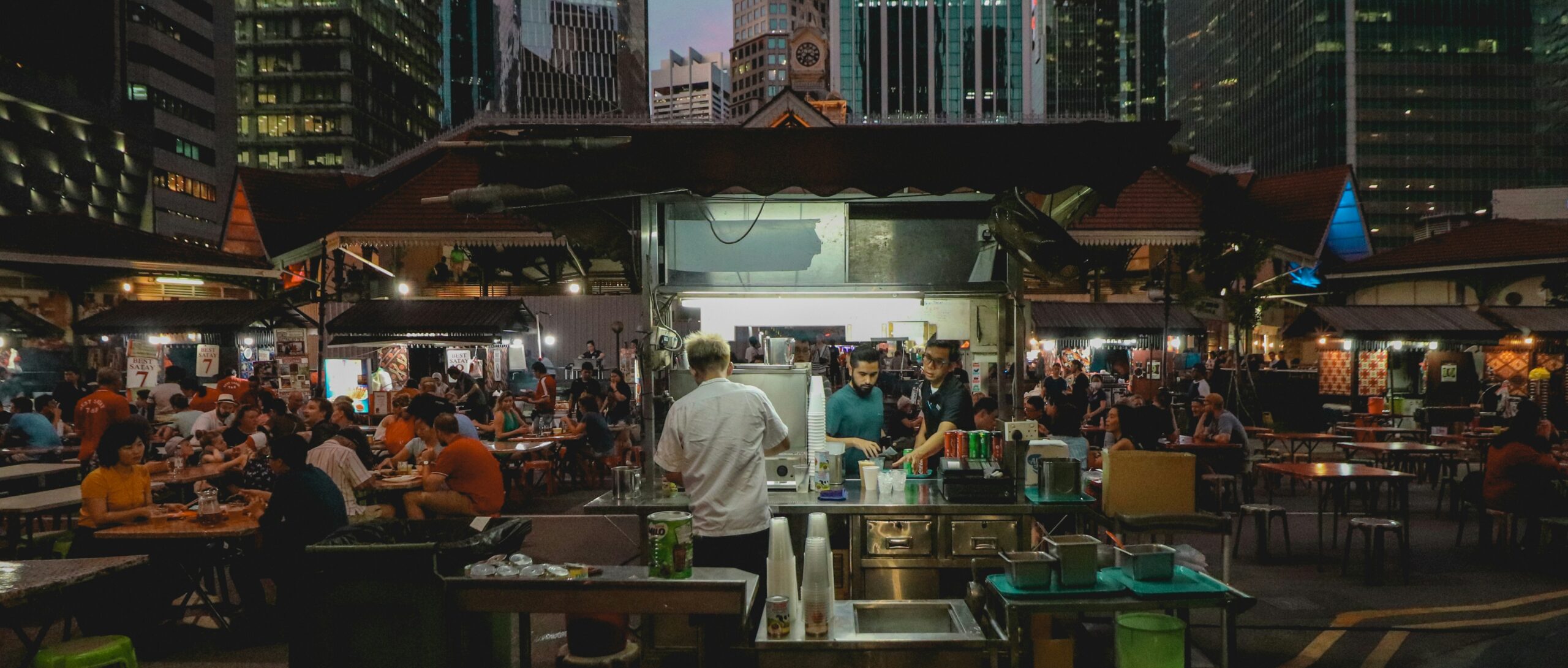 Busy and lively night market at Lau Pa Sat with communal seating