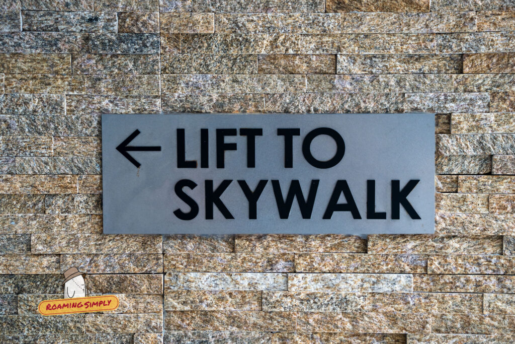 Directional sign pointing to lift for Skywalk at Fort Siloso Sentosa Singapore
