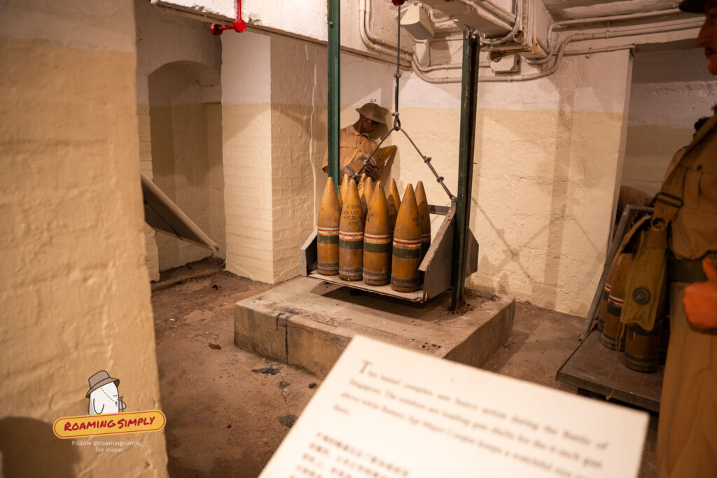 WWII ammunition store inside Fort Siloso Sentosa Singapore with wax soldier figure and 6-inch gun shells