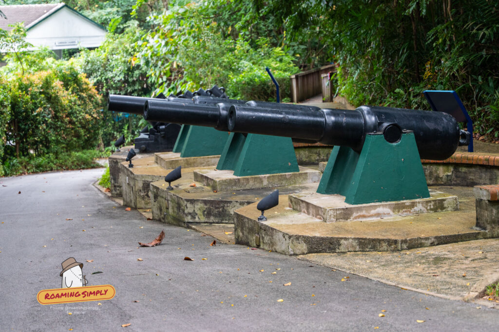 A2 Row of preserved WWII-era black cannons mounted on green stands at Fort Siloso heritage site