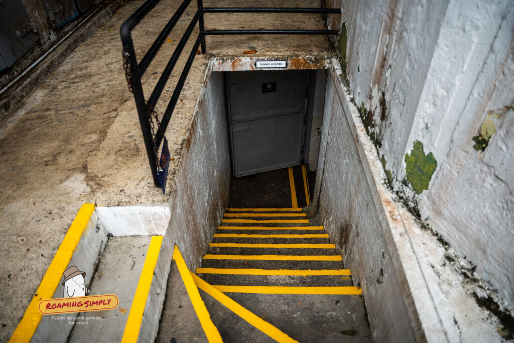Tunnel B entry staircase with yellow safety markings at Fort Siloso Sentosa Singapore