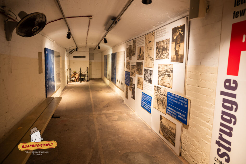 Inside Fort Siloso tunnel with WWII wartime photo exhibition and wax soldier figure Sentosa Singapore