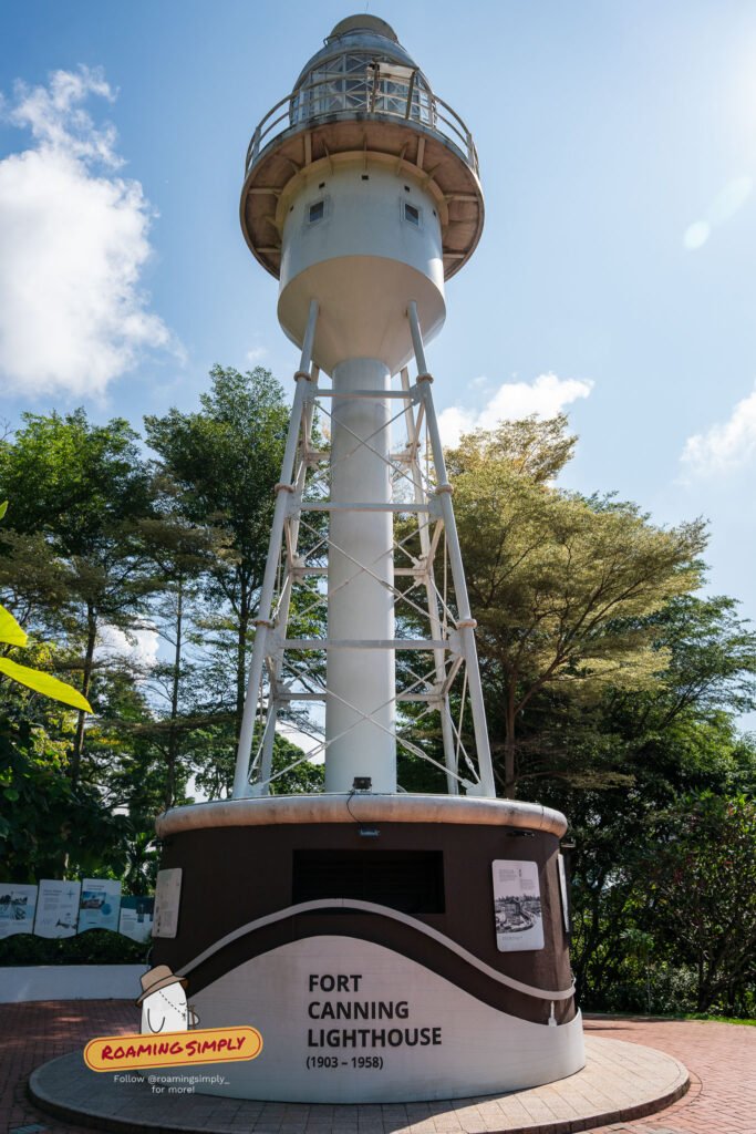 The white Fort Canning Lighthouse tower against a blue sky at Fort Canning Park, Singapore