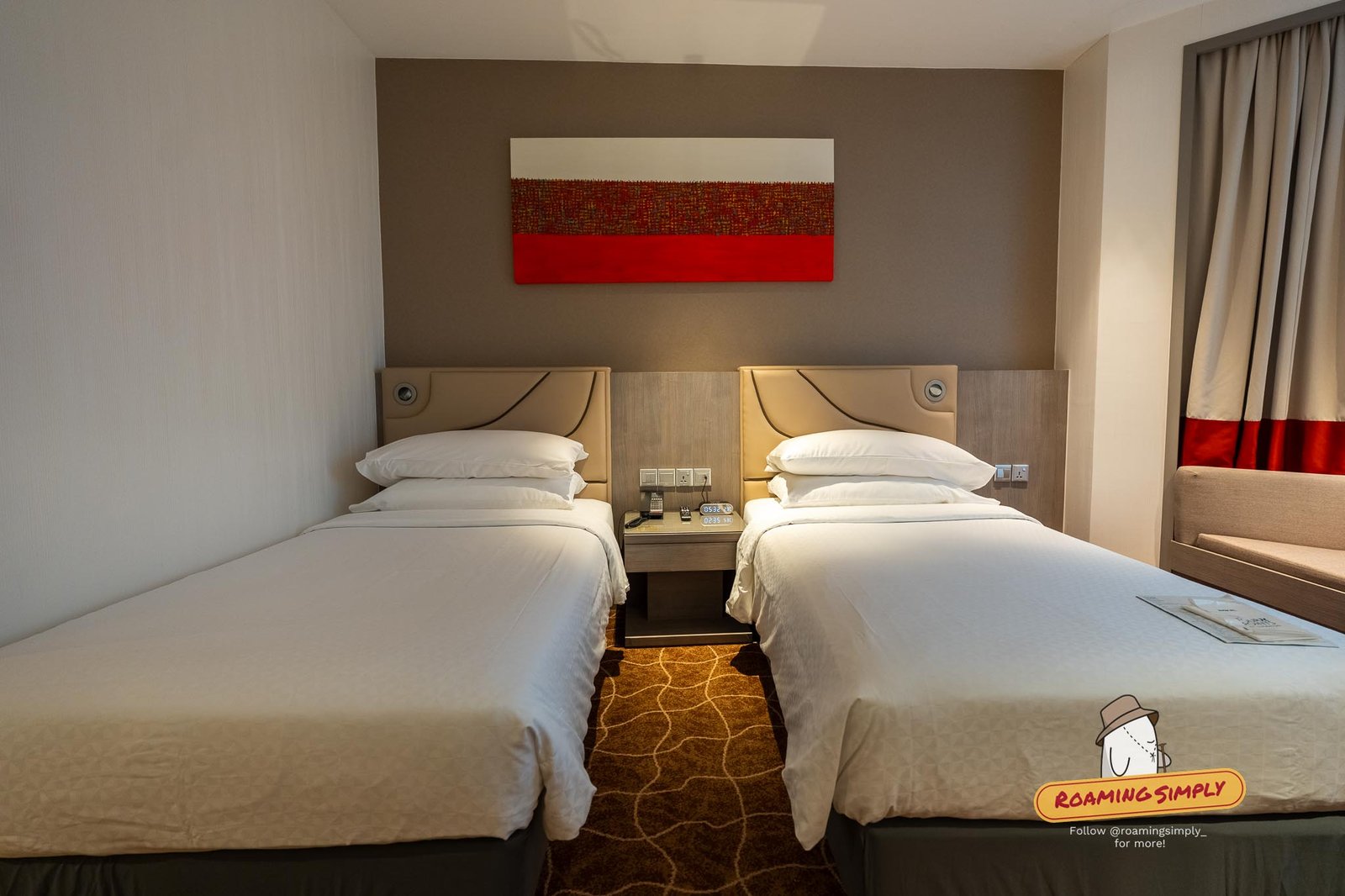 Bed in the Four Points by Sheraton Riverview Deluxe Room