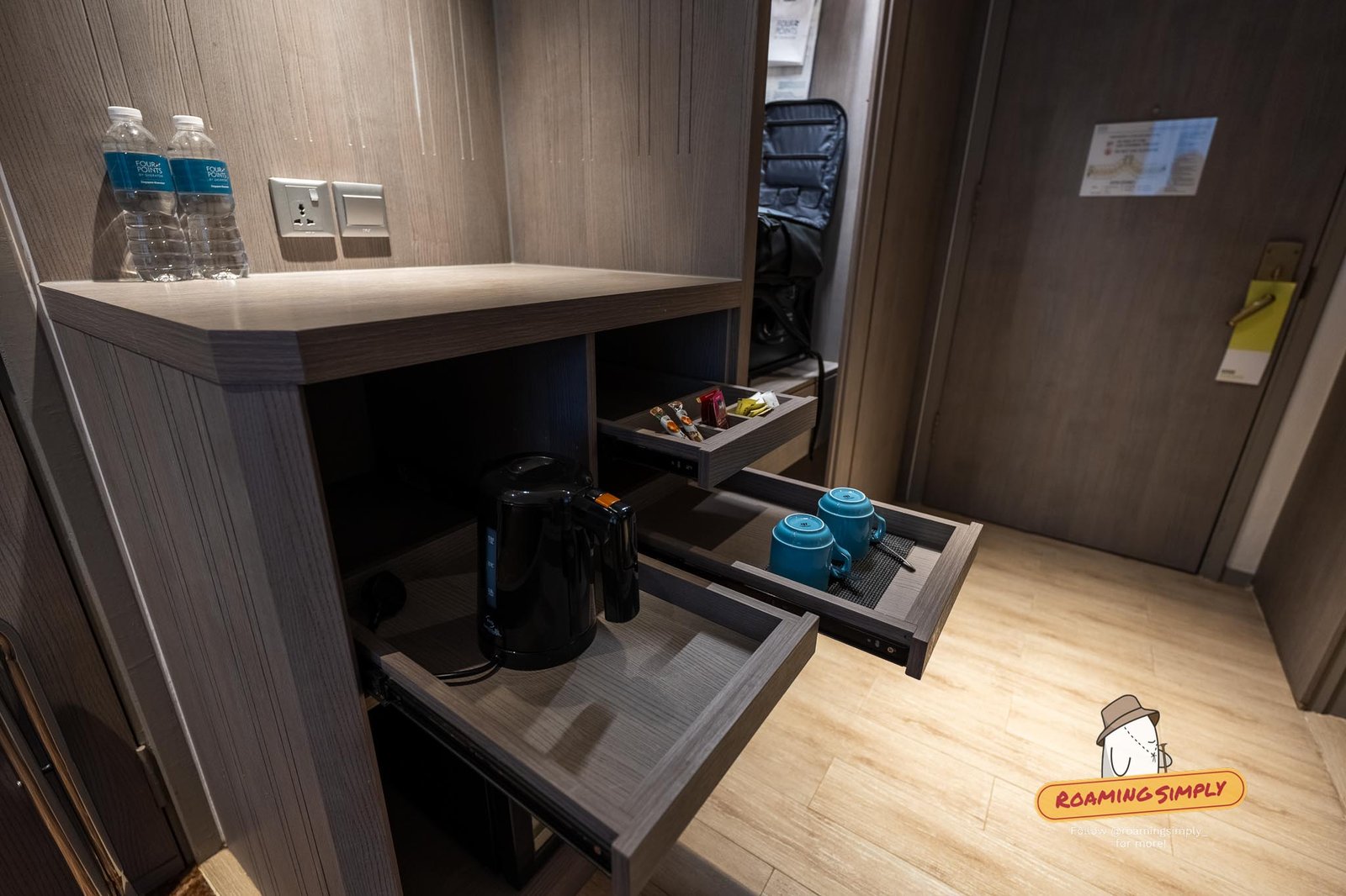 In-room coffee and tea station with kettle and complimentary water