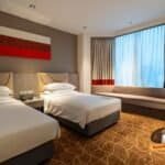 Deluxe Room at Four Points by Sheraton Singapore Riverview, showing the bed and full-width window