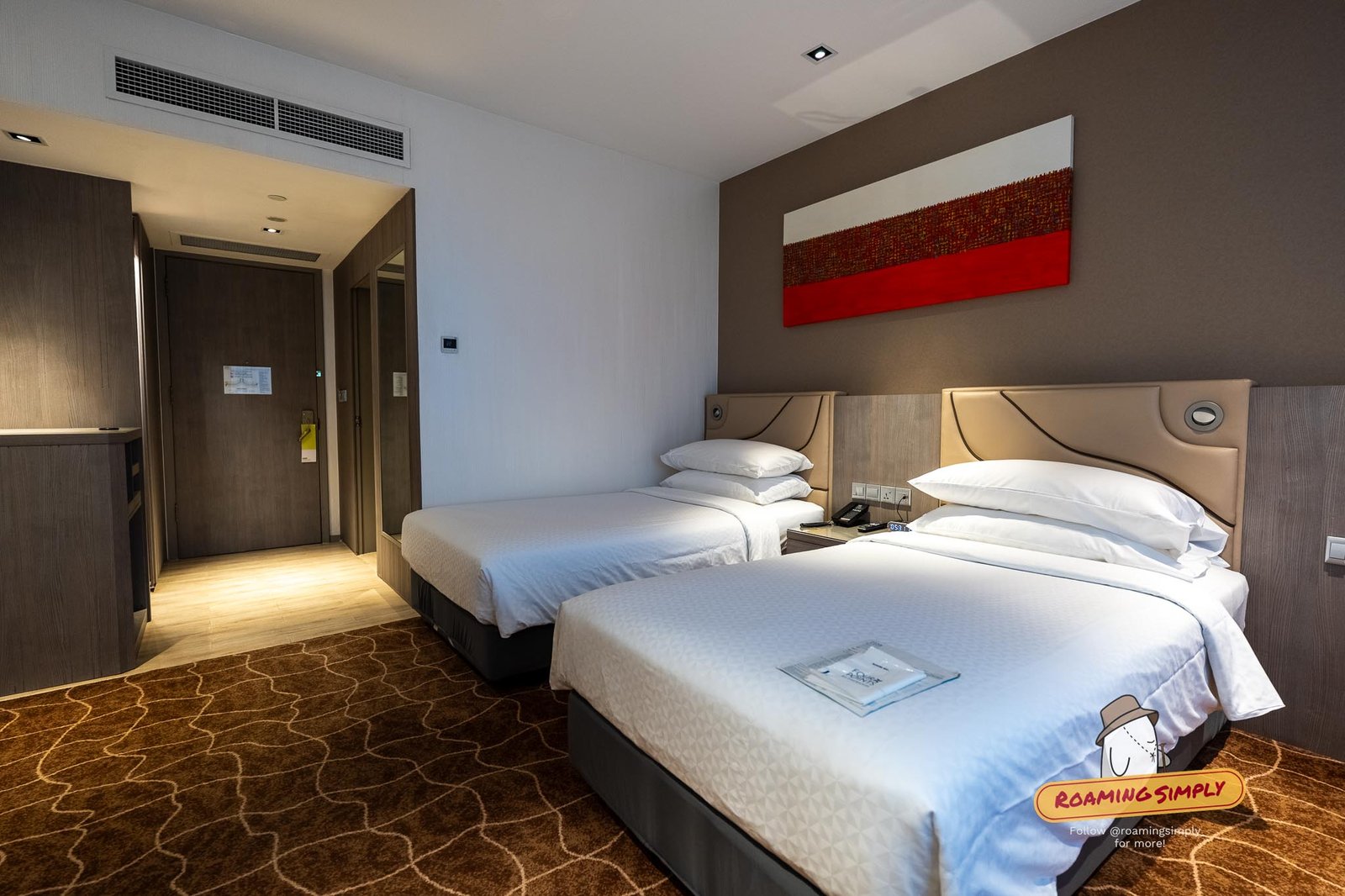 Four Points by Sheraton Riverview Deluxe Room viewed from the doorway toward the full-width window