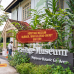 Heritage Museum sign at Singapore Botanic Gardens with the article title overlaid